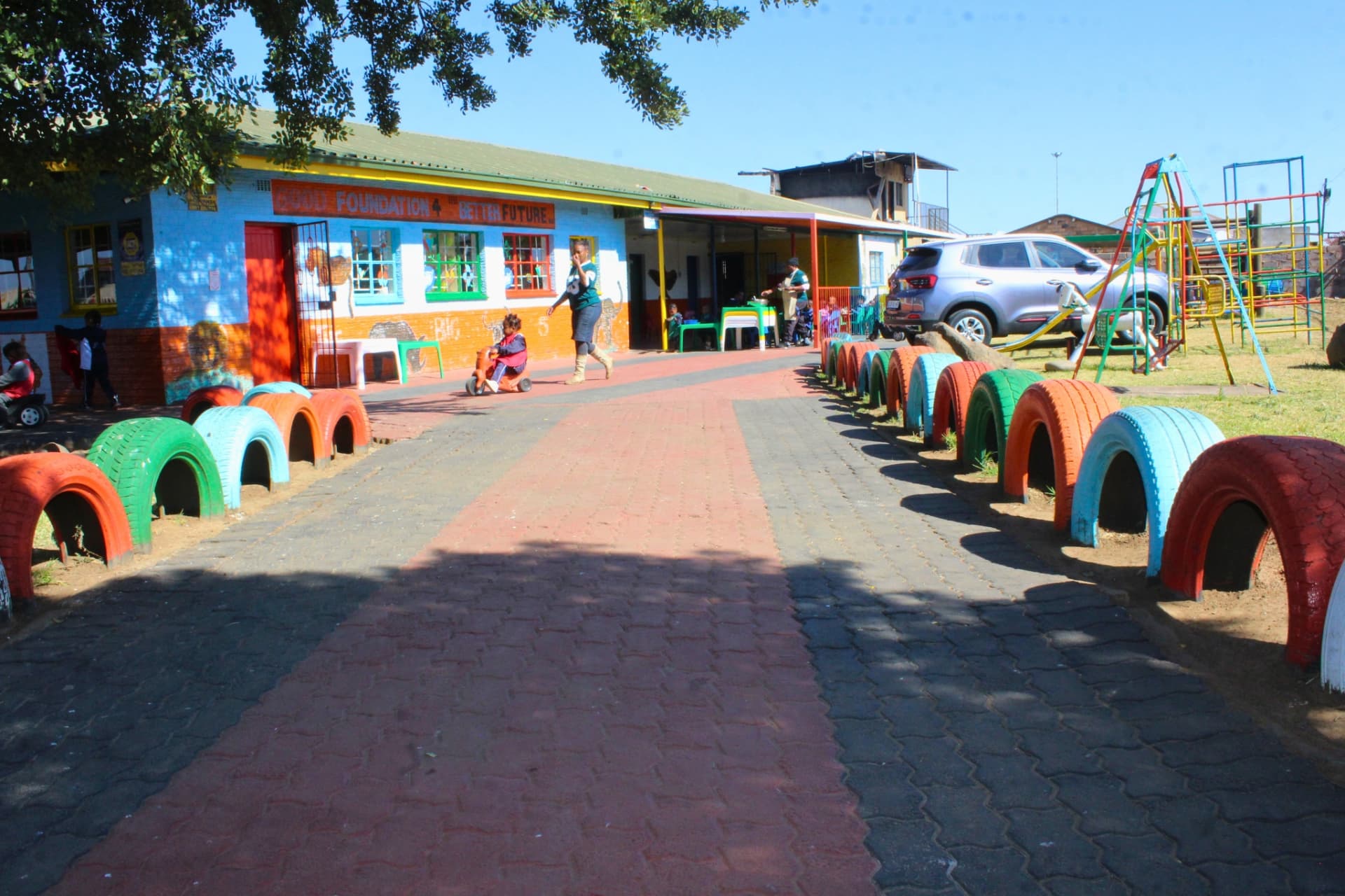 The Matla Pre School campus in Mdeni, Soweto with its painted tyre walkway, classrooms and playground