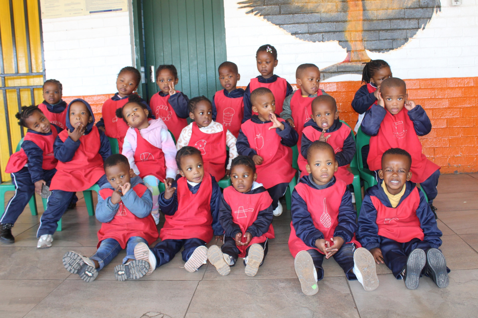 Red group learners seated together for a class photo at Matla Pre School