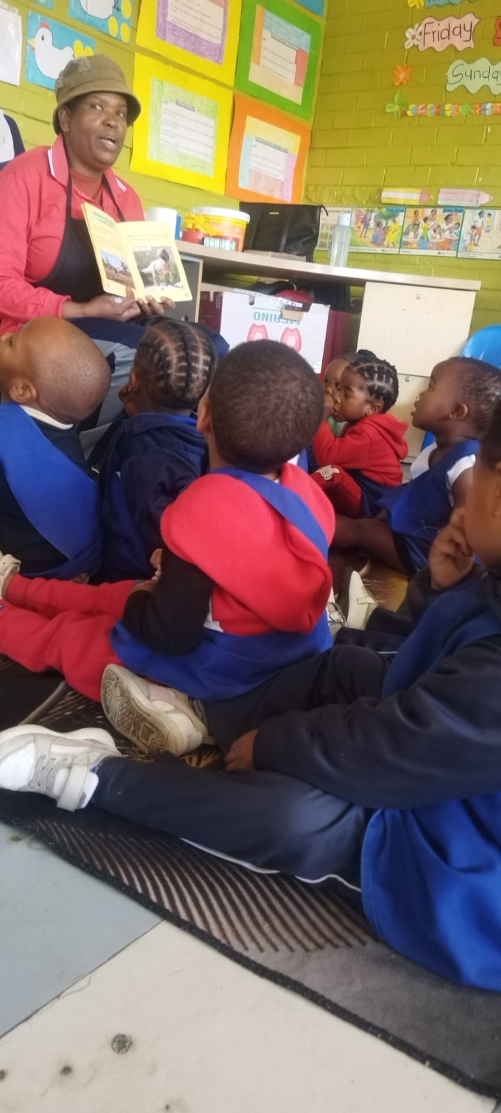 Learners listening attentively during a classroom story time session